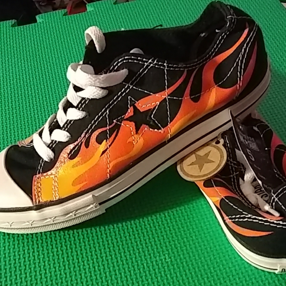 Pair of Converse One Star flame tennis shoes